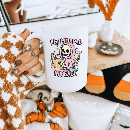 Let Me Read in Peace Spooky Bookish Mug | Skeleton Reading Coffee Cup | Spooky Cute Halloween Reader Gifts | Bookish Fall Mug | Cute Goth